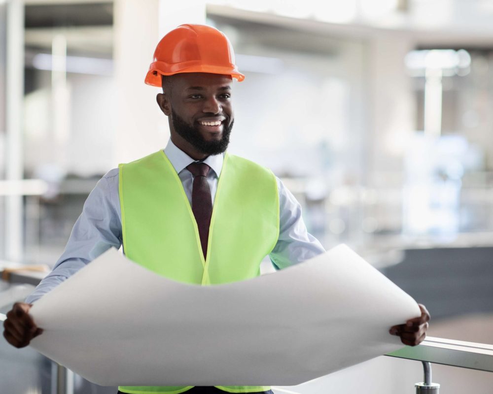 cheerful-black-civil-engineer-in-safety-workwear-h-2026-01-08-23-12-29-utc(1)
