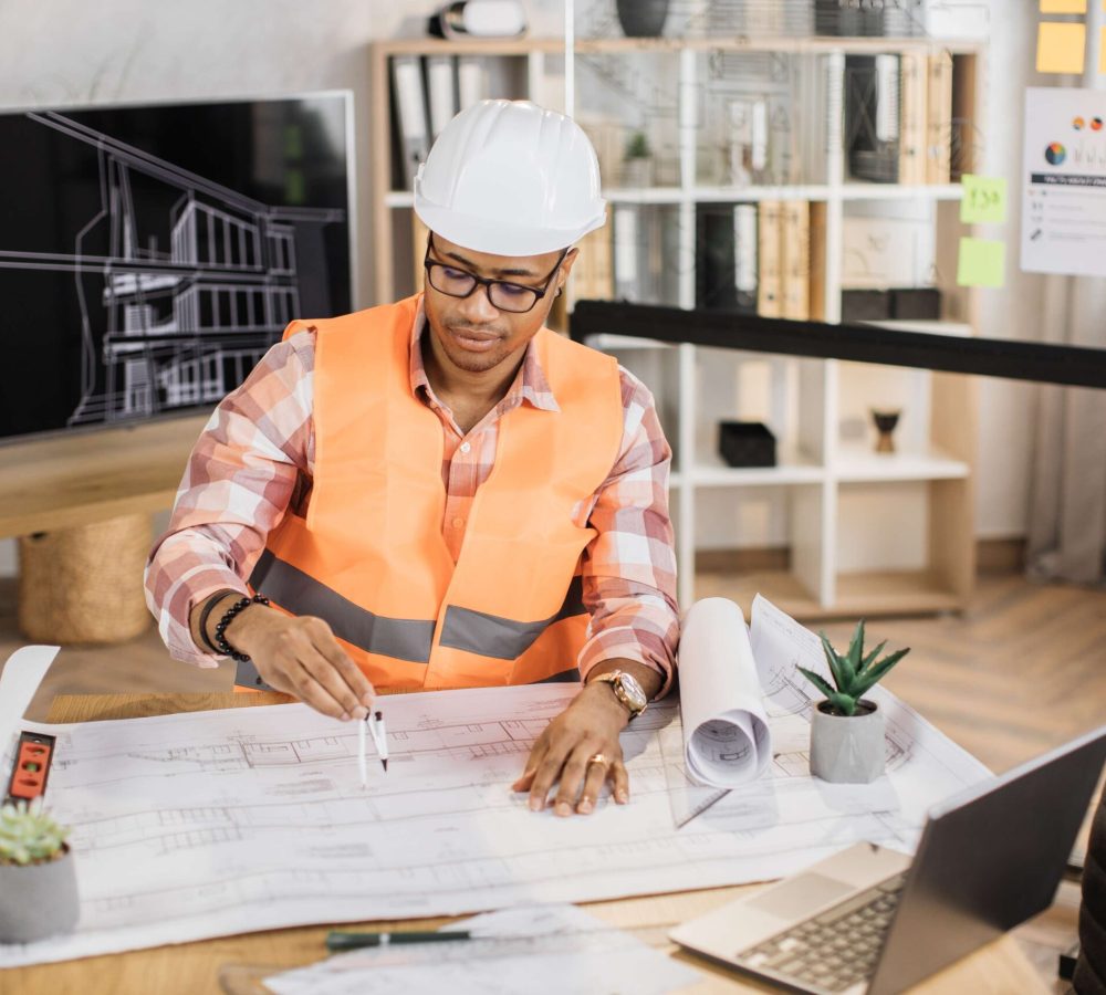 young-african-builder-engineer-browsing-in-laptop-2026-01-07-01-23-03-utc(1)